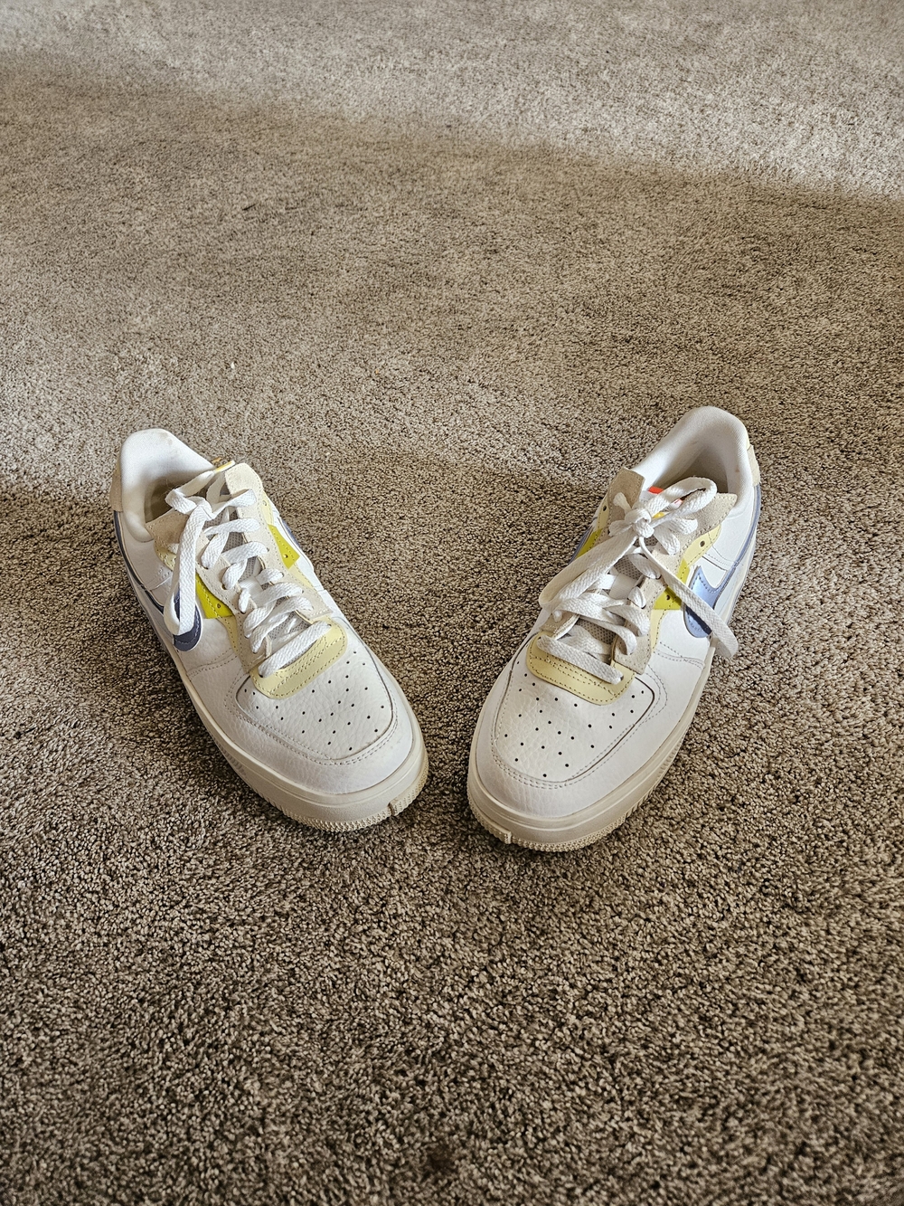 Nike Low-Top Sneakers in White with Pale Yellow & Light Blue Accents